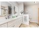 Bathroom with double vanity, framed mirrors, and decorative accents at 2833 Praire View Pt, Wendell, NC 27591