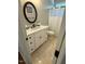 This bathroom features a vanity with a sink, drawers, a toilet, an oval mirror and a shower with a curtain at 2833 Praire View Pt, Wendell, NC 27591