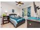 Comfortable bedroom with natural light, ceiling fan, and carpeted flooring, furnished with an Eagles theme at 2833 Praire View Pt, Wendell, NC 27591