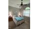 Cozy bedroom featuring a ceiling fan, large window, and comfortable bed, creating a serene retreat at 2833 Praire View Pt, Wendell, NC 27591