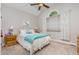 Bright bedroom features an arched window, neutral walls, carpet flooring and ceiling fan at 2833 Praire View Pt, Wendell, NC 27591