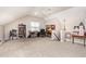 Large bonus room with carpeting, desks, ceiling fan, natural light and stairs at 2833 Praire View Pt, Wendell, NC 27591