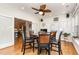 Bright breakfast area featuring wood floors, ceiling fan, and doorway to kitchen at 2833 Praire View Pt, Wendell, NC 27591