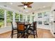 Cozy breakfast area with a ceiling fan and lots of natural light from the surrounding windows at 2833 Praire View Pt, Wendell, NC 27591