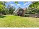 Well-maintained home with brick accents, lawn, mature trees, and manicured shrubs at 2833 Praire View Pt, Wendell, NC 27591