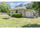 Detached garage on grassy lot with mature trees and a picnic table at 2833 Praire View Pt, Wendell, NC 27591