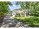 Inviting two-story home with a long driveway, attached garage, and well-manicured lawn and landscaping at 2833 Praire View Pt, Wendell, NC 27591