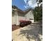 Home exterior featuring a long driveway and beautiful landscaping, creating an inviting entrance at 2833 Praire View Pt, Wendell, NC 27591