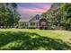 Charming two-story home with a well-maintained lawn and complemented by mature trees at 2833 Praire View Pt, Wendell, NC 27591
