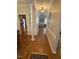 Inviting hallway with hardwood floors and decorative lighting at 2833 Praire View Pt, Wendell, NC 27591