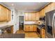 Well-equipped kitchen features stainless steel appliances, granite counters and wooden cabinets at 2833 Praire View Pt, Wendell, NC 27591