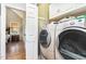Bright laundry room featuring washer, dryer, and built in cabinets at 2833 Praire View Pt, Wendell, NC 27591