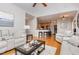 Open-concept living room with views of the kitchen, hardwood floors, and neutral color palette at 2833 Praire View Pt, Wendell, NC 27591