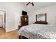 Comfortable bedroom features hardwood floors, ceiling fan and a large dresser with mirror at 2833 Praire View Pt, Wendell, NC 27591