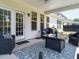 Comfortable back porch area with outdoor seating and a ceiling fan at 2909 Thurman Dairy Loop, Wake Forest, NC 27587