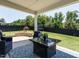 Comfortable back porch area with outdoor seating overlooking the back yard at 2909 Thurman Dairy Loop, Wake Forest, NC 27587