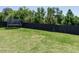 Large, fenced backyard with lush green grass and shade trees at 2909 Thurman Dairy Loop, Wake Forest, NC 27587