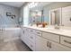 Bright bathroom with double vanity, soaking tub, and separate shower at 2909 Thurman Dairy Loop, Wake Forest, NC 27587