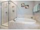 Elegant bathroom featuring a shower and separate soaking tub at 2909 Thurman Dairy Loop, Wake Forest, NC 27587