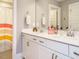 Bathroom featuring double sinks and a shower/bath combo with a rainbow curtain at 2909 Thurman Dairy Loop, Wake Forest, NC 27587