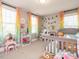 Bright bedroom with two large windows and personal decorations at 2909 Thurman Dairy Loop, Wake Forest, NC 27587