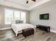 Serene bedroom featuring natural light and hardwood floors at 2909 Thurman Dairy Loop, Wake Forest, NC 27587