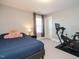 Bedroom with large bed, modern exercise bike, and great natural light at 2909 Thurman Dairy Loop, Wake Forest, NC 27587