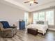 Relaxing bedroom featuring a comfortable bed, natural light, and hardwood floors at 2909 Thurman Dairy Loop, Wake Forest, NC 27587