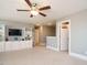 Spacious bonus room with built-in bookshelves and a ceiling fan at 2909 Thurman Dairy Loop, Wake Forest, NC 27587