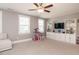 Large bonus room featuring a ceiling fan, natural light and built in cabinets at 2909 Thurman Dairy Loop, Wake Forest, NC 27587