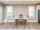 Bright dining area with hardwood floors, table, and natural light at 2909 Thurman Dairy Loop, Wake Forest, NC 27587