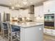 Modern kitchen with stainless steel appliances, granite countertops, and ample cabinet space at 2909 Thurman Dairy Loop, Wake Forest, NC 27587