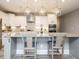 Stylish kitchen island with pendant lighting and seating, perfect for entertaining guests at 2909 Thurman Dairy Loop, Wake Forest, NC 27587