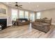 Spacious living room with lots of natural light, hardwood floors and comfortable seating at 2909 Thurman Dairy Loop, Wake Forest, NC 27587