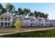 Street view showcasing several two-story homes with well-maintained landscaping at 332 White Oak Garden Way # 221, Garner, NC 27529