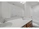 Bright bathroom with double sinks, granite countertops, and a shower-tub combo at 333 Trout Valley Rd, Wake Forest, NC 27587