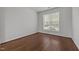 Cozy bedroom with hardwood floors, a bright window, and neutral walls at 333 Trout Valley Rd, Wake Forest, NC 27587