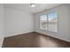 Bedroom featuring a window providing plenty of natural light and hardwood floors at 333 Trout Valley Rd, Wake Forest, NC 27587