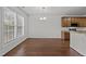 Open floor plan with hardwood floors, connecting kitchen to dining area at 333 Trout Valley Rd, Wake Forest, NC 27587