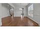 Open dining area with hardwood floors, bright windows, and decorative chandelier at 333 Trout Valley Rd, Wake Forest, NC 27587