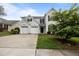 Charming two-story home featuring a two-car garage and meticulously maintained lawn with a beautiful shrub at 333 Trout Valley Rd, Wake Forest, NC 27587