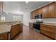 Modern kitchen featuring granite counters and wood cabinets and stainless appliances at 333 Trout Valley Rd, Wake Forest, NC 27587