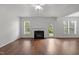 Bright living room with hardwood floors, fireplace, and natural light from windows and glass door at 333 Trout Valley Rd, Wake Forest, NC 27587