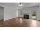 Bright living room featuring hardwood floors, fireplace, and natural light at 333 Trout Valley Rd, Wake Forest, NC 27587