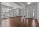 Bright living room features hardwood floors, crown molding, and ample natural light from large windows at 333 Trout Valley Rd, Wake Forest, NC 27587