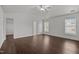 Main bedroom with hardwood floors and lots of light from the windows and access to a walk-in closet at 333 Trout Valley Rd, Wake Forest, NC 27587