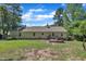 This spacious backyard includes a patio deck, a well-maintained lawn, and mature trees at 345 Kinsman Ct, Fuquay Varina, NC 27526