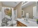 Bathroom featuring a white vanity, toilet and a shower with a unique curtain at 345 Kinsman Ct, Fuquay Varina, NC 27526