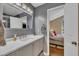 Well-lit bathroom showcases a large vanity, stylish fixtures and gray walls at 345 Kinsman Ct, Fuquay Varina, NC 27526