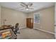 Bedroom with neutral walls, a ceiling fan, carpeted floors and a desk at 345 Kinsman Ct, Fuquay Varina, NC 27526